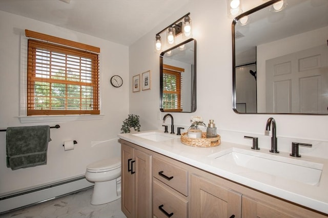 full bathroom featuring a baseboard heating unit, marble finish floors, toilet, and double vanity