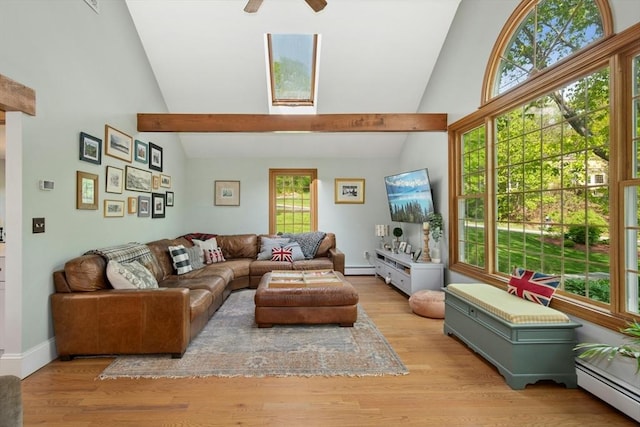 living area with a baseboard heating unit, high vaulted ceiling, wood finished floors, a ceiling fan, and baseboards