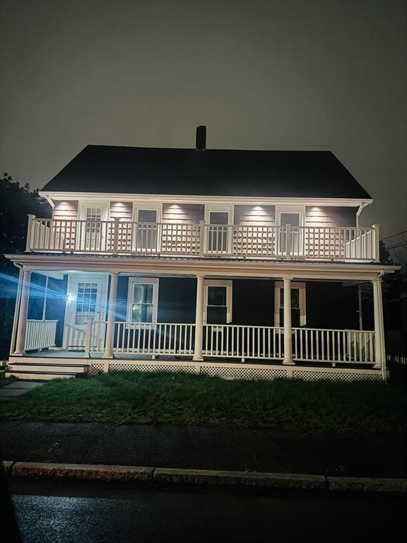 6 Smith St, Taunton, MA 02780 - back of house at twilight with a balcony and a porch