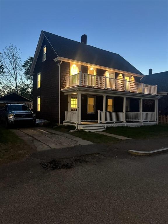 6 Smith St, Taunton, MA 02780 - view of front of house featuring a balcony, a chimney, and a porch