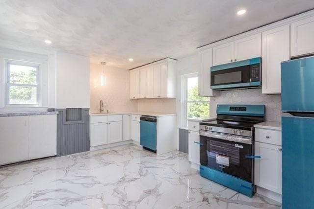 6 Smith St, Taunton, MA 02780 - kitchen featuring black microwave, freestanding refrigerator, electric range, dishwashing machine, and a sink