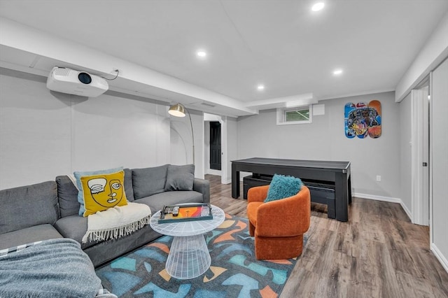 living room with wood finished floors, recessed lighting, and baseboards