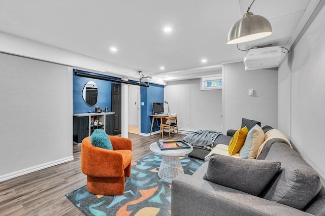 living area featuring wood finished floors, recessed lighting, and baseboards