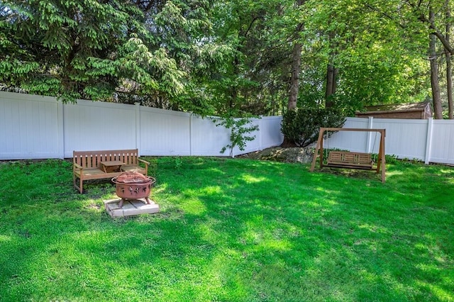 view of yard with an outdoor fire pit