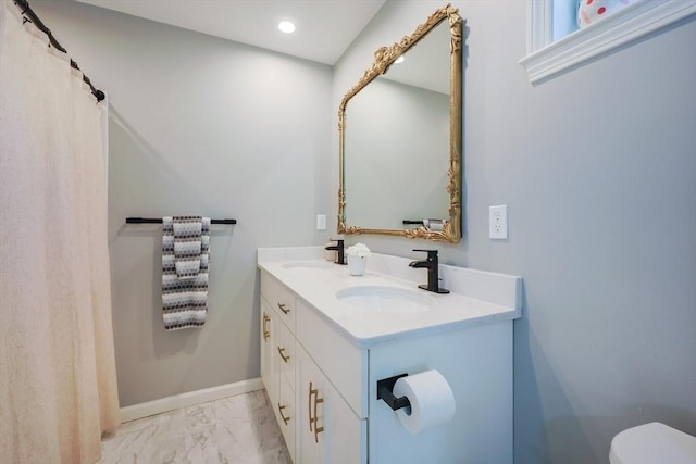 19 Millies Way, Sterling, MA 01564 - full bath featuring marble look tiles, toilet, recessed lighting, double vanity, and baseboards