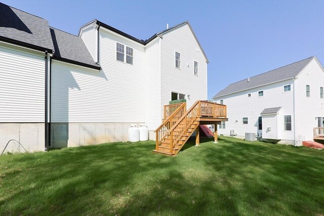 19 Millies Way, Sterling, MA 01564 - rear view of property featuring stairs, a wooden deck, a lawn, and central air condition unit