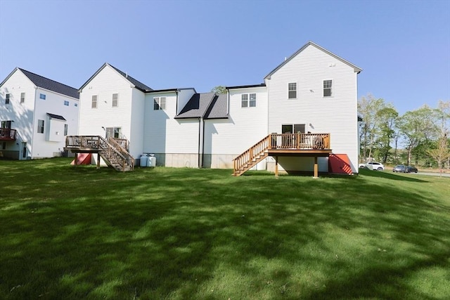 19 Millies Way, Sterling, MA 01564 - back of house featuring stairway, a wooden deck, and a yard