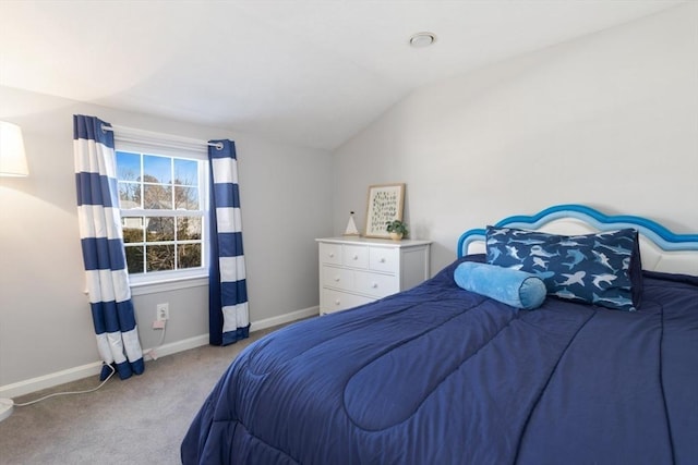 bedroom with baseboards, lofted ceiling, and carpet flooring