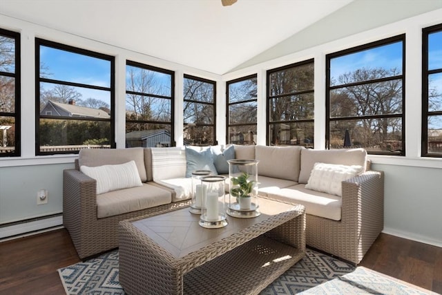 sunroom featuring lofted ceiling and a baseboard radiator