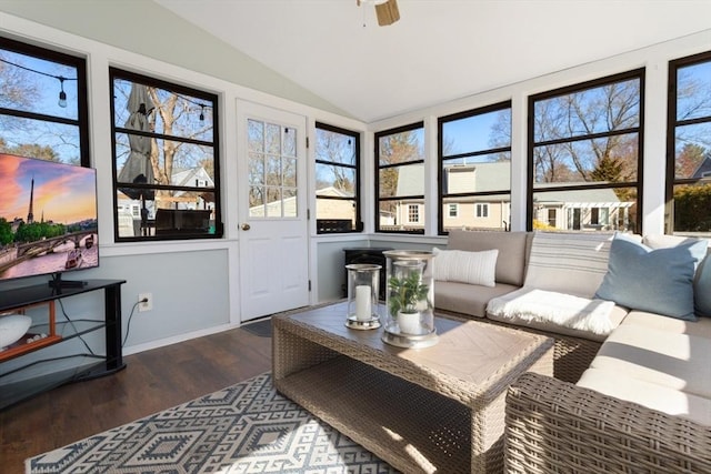 sunroom featuring lofted ceiling and ceiling fan