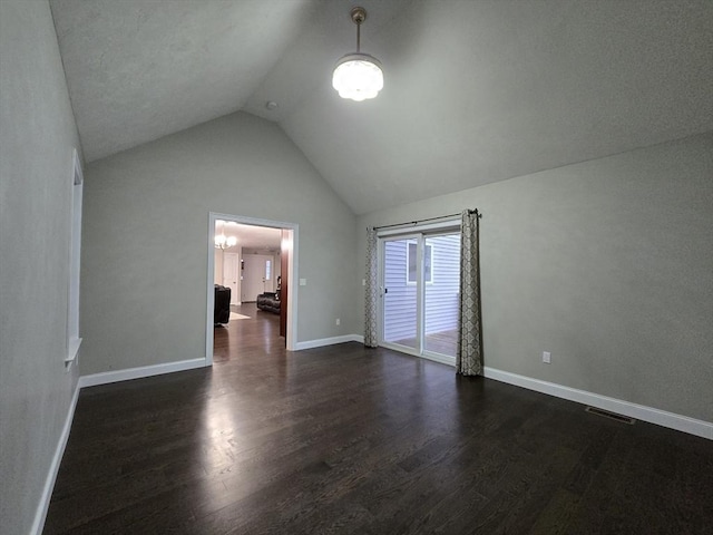 84 Murray Cir, Stoughton, MA 02072 - unfurnished room featuring dark wood-style floors, vaulted ceiling, baseboards, and a chandelier