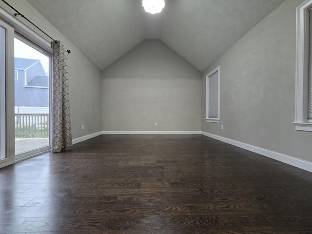84 Murray Cir, Stoughton, MA 02072 - additional living space with vaulted ceiling, dark wood-type flooring, and baseboards