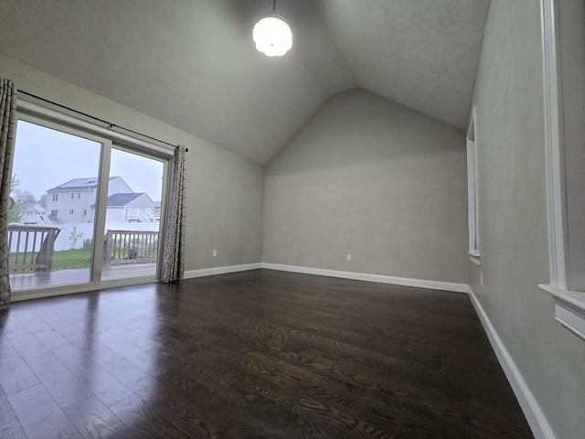 84 Murray Cir, Stoughton, MA 02072 - bonus room with lofted ceiling, dark wood-style flooring, and baseboards