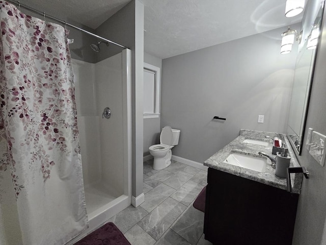 84 Murray Cir, Stoughton, MA 02072 - bathroom with marble look tile flooring, a shower stall, toilet, baseboards, and double vanity