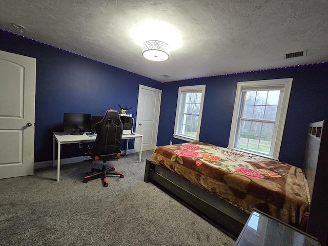 84 Murray Cir, Stoughton, MA 02072 - bedroom featuring a desk, carpet, a textured ceiling, and baseboards