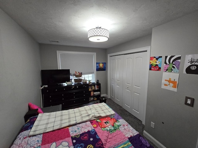 84 Murray Cir, Stoughton, MA 02072 - bedroom with baseboards, a closet, and dark carpet