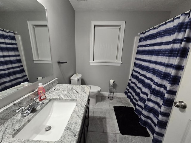 84 Murray Cir, Stoughton, MA 02072 - bathroom featuring toilet, vanity, baseboards, and curtained shower