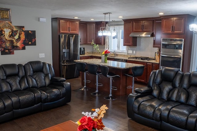 84 Murray Cir, Stoughton, MA 02072 - living area featuring dark wood-style floors and recessed lighting