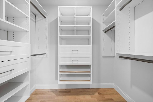 spacious closet with light wood finished floors