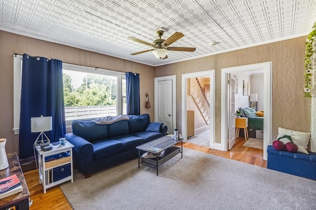 514 W Britannia St, Taunton, MA 02780 - living area with an ornate ceiling, ceiling fan, stairs, light wood finished floors, and crown molding