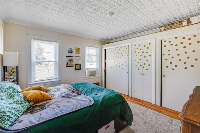 514 W Britannia St, Taunton, MA 02780 - carpeted bedroom with ornamental molding, cooling unit, an ornate ceiling, and multiple closets