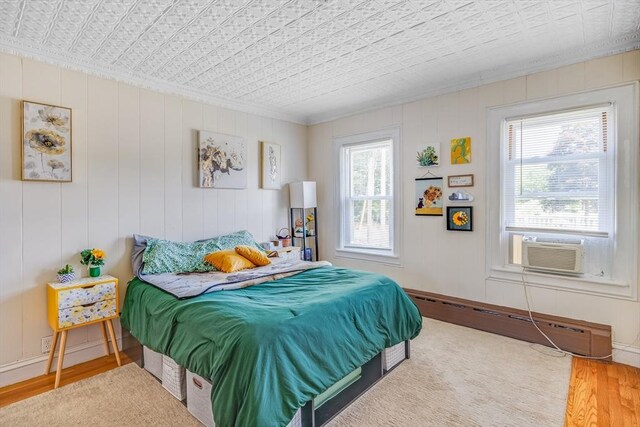 514 W Britannia St, Taunton, MA 02780 - bedroom with ornamental molding, multiple windows, a baseboard heating unit, an ornate ceiling, and wood finished floors