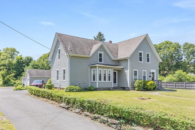 514 W Britannia St, Taunton, MA 02780 - view of front of house with roof with shingles and a chimney