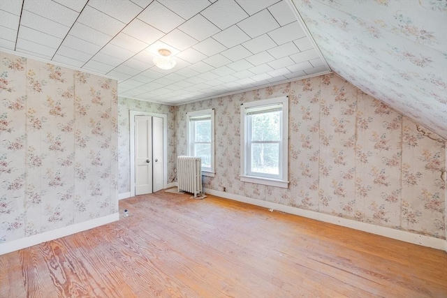 514 W Britannia St, Taunton, MA 02780 - bonus room with radiator heating unit, wood finished floors, and lofted ceiling