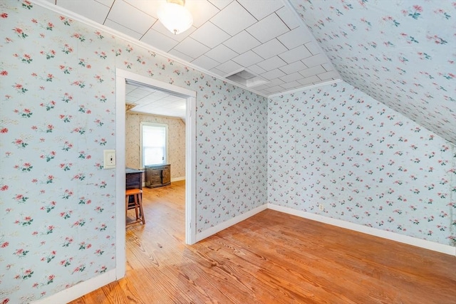 514 W Britannia St, Taunton, MA 02780 - additional living space featuring light wood-style flooring, wallpapered walls, and lofted ceiling