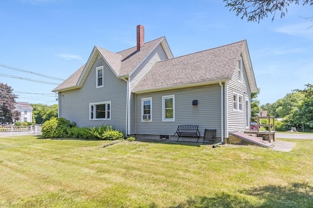 514 W Britannia St, Taunton, MA 02780 - rear view of property featuring a chimney, a lawn, and roof with shingles