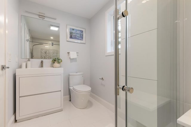 full bath featuring a stall shower, baseboards, toilet, tile patterned flooring, and vanity