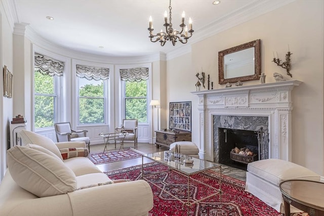 living room with a premium fireplace, hardwood / wood-style floors, a chandelier, and ornamental molding