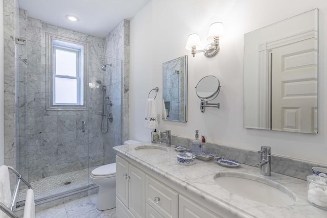 bathroom featuring toilet, vanity, and walk in shower