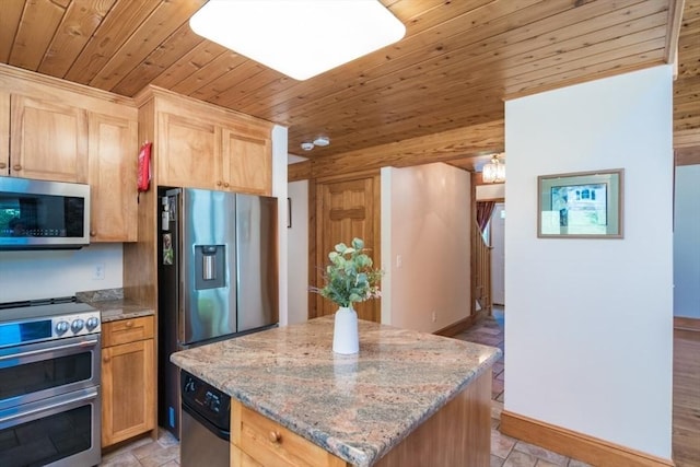 271 Rte 87, Columbia, CT 06237 - kitchen with appliances with stainless steel finishes, wooden ceiling, light brown cabinetry, light stone countertops, and a center island