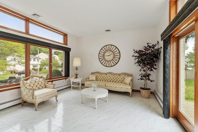 0 E Border Cir, Medford, MA 02155 - living area featuring a baseboard heating unit and healthy amount of natural light