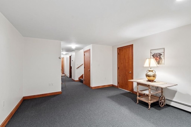 0 E Border Cir, Medford, MA 02155 - empty room featuring baseboards, carpet floors, stairway, and a baseboard radiator