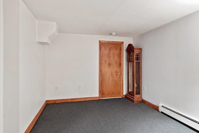 0 E Border Cir, Medford, MA 02155 - carpeted empty room featuring a baseboard heating unit, baseboards, and a smoke detector
