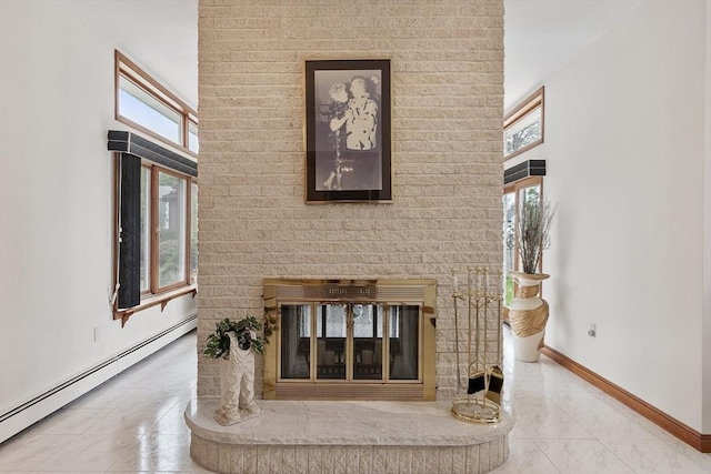0 E Border Cir, Medford, MA 02155 - detailed view of baseboard heating, baseboards, and a multi sided fireplace