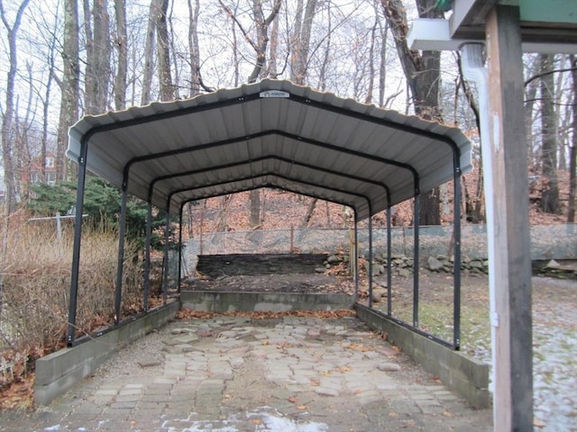 view of parking / parking lot featuring a carport