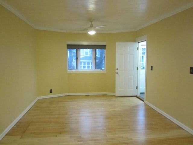 spare room with light hardwood / wood-style flooring, ceiling fan, and crown molding