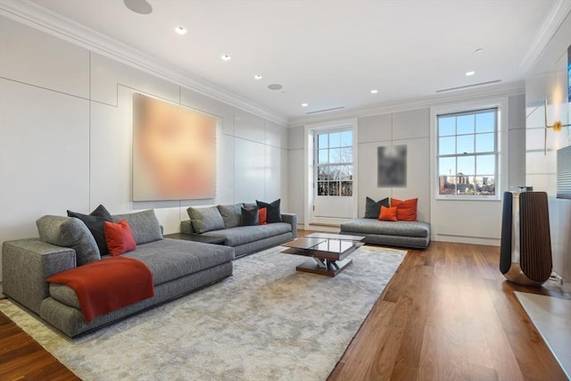 living room featuring recessed lighting, wood finished floors, and ornamental molding