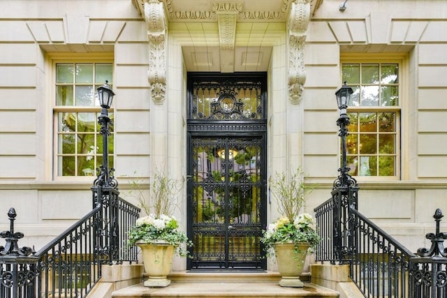 doorway to property featuring stone siding