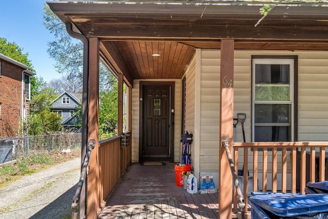 view of exterior entry featuring a porch