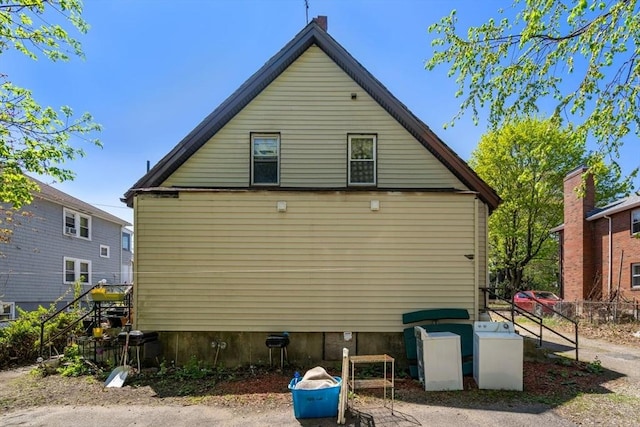 view of property exterior featuring fence