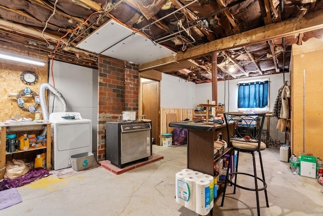 basement with washing machine and clothes dryer and refrigerator