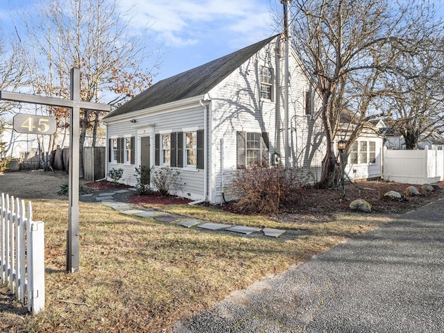 view of home's exterior with a yard