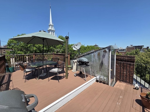 26 Unity St Unit 2, Boston, MA 02113 - wooden terrace with outdoor dining space and grilling area