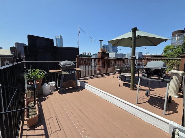 26 Unity St Unit 2, Boston, MA 02113 - wooden terrace featuring a grill and outdoor dining space