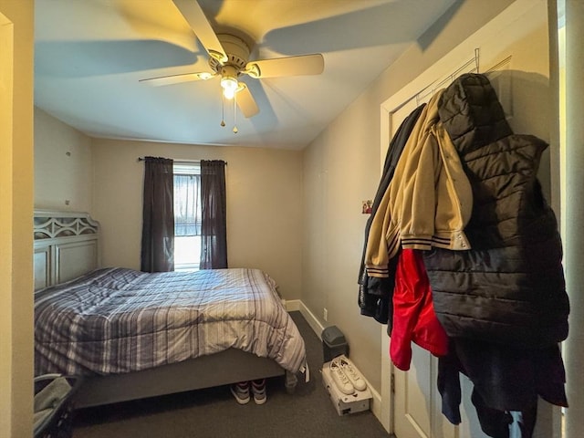 bedroom featuring ceiling fan and baseboards