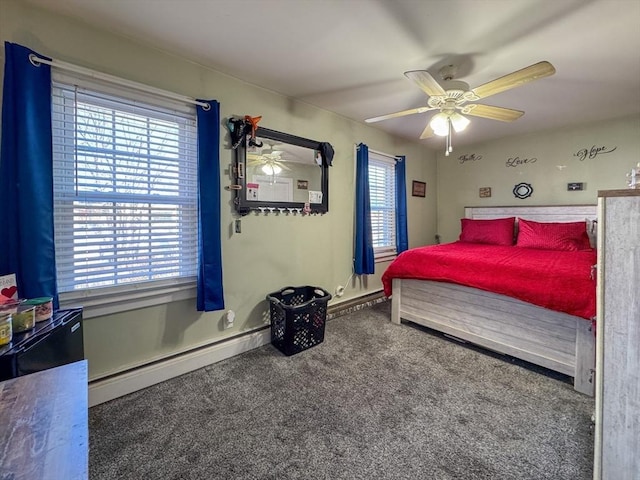 bedroom featuring a baseboard heating unit, carpet floors, and a ceiling fan